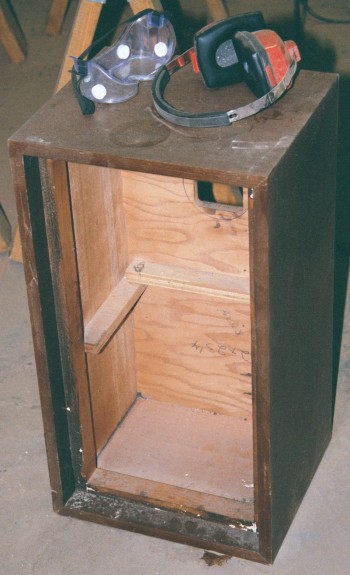 a raw and stripped cabinet