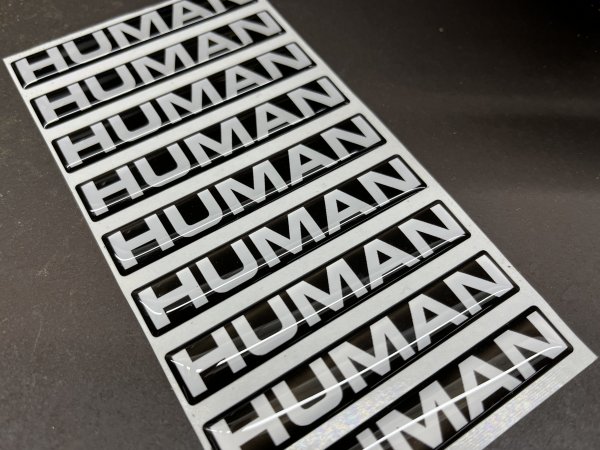 New HUMAN grill badge